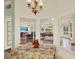Cozy breakfast nook featuring views through multiple windows into the sunroom at 10732 Drummond Rd, Tampa, FL 33615