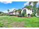 Charming single-story home features beautiful landscaping and a well-manicured lawn at 10732 Drummond Rd, Tampa, FL 33615
