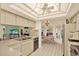 Kitchen with a bright skylight, tile floors, and an open view to the breakfast nook at 10732 Drummond Rd, Tampa, FL 33615