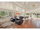 Open concept living area featuring a game room, sun room, and comfortable seating at 10732 Drummond Rd, Tampa, FL 33615