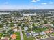 Aerial view of a neighborhood with lush greenery and waterfront views at 1084 39Th Ne Ave, St Petersburg, FL 33703