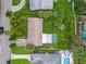 Aerial view of a well-maintained home showcasing a spacious yard and patio at 1084 39Th Ne Ave, St Petersburg, FL 33703