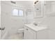 Clean bathroom featuring white tile, a large mirror, and a shower-tub combo at 1084 39Th Ne Ave, St Petersburg, FL 33703