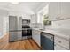Bright kitchen featuring modern stainless-steel appliances and white cabinets at 1084 39Th Ne Ave, St Petersburg, FL 33703