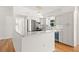 Bright kitchen features white cabinets, stainless steel appliances, and a breakfast bar for convenient dining at 1084 39Th Ne Ave, St Petersburg, FL 33703