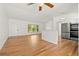 Spacious living room with hardwood floors, bright windows, and an open layout at 1084 39Th Ne Ave, St Petersburg, FL 33703