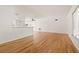 Open-concept living space featuring hardwood floors and a view into the kitchen area at 1084 39Th Ne Ave, St Petersburg, FL 33703