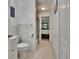 Clean and bright bathroom featuring tiled floors and a shower over tub at 110 114Th Ne Ter # 110, St Petersburg, FL 33716