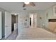Bedroom featuring neutral decor, decorative wall hangings and a doorway to the bath at 110 114Th Ne Ter # 110, St Petersburg, FL 33716