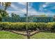Close up of Windward Pointe community sign, lush landscape and serene neighborhood ambiance at 110 114Th Ne Ter # 110, St Petersburg, FL 33716