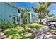 Inviting townhome exterior with lush green lawn, sidewalks, and convenient parking at 110 114Th Ne Ter # 110, St Petersburg, FL 33716