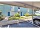 Charming exterior view of a condo community with well-maintained landscaping and covered parking at 110 114Th Ne Ter # 110, St Petersburg, FL 33716