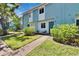 Charming two-story townhome with a well-maintained lawn and blue exterior paint at 110 114Th Ne Ter # 110, St Petersburg, FL 33716