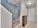 Entryway hallway featuring tile flooring, shoe storage, mirror feature, and neutral colors at 110 114Th Ne Ter # 110, St Petersburg, FL 33716