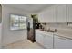 Efficient kitchen with a window, offering bright natural light and practical appliances for easy meal preparation at 110 114Th Ne Ter # 110, St Petersburg, FL 33716