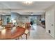 Open-concept interior with tile floors, dining area, living room, and view to the screened-in lanai at 110 114Th Ne Ter # 110, St Petersburg, FL 33716