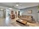 Open-concept living room features tile flooring, and access to the dining area and sliding glass doors to patio at 110 114Th Ne Ter # 110, St Petersburg, FL 33716
