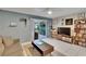 Comfortable living room featuring a sliding glass door and built-in shelving at 110 114Th Ne Ter # 110, St Petersburg, FL 33716