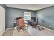 Office with two desks, rolling chairs, and large window providing natural light at 110 114Th Ne Ter # 110, St Petersburg, FL 33716