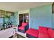 Comfortable screened patio with tiled floors, relaxing seating, and potted plants at 110 114Th Ne Ter # 110, St Petersburg, FL 33716