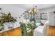 Elegant dining room with glass table and chandelier, ideal for formal gatherings at 11250 Tradewinds Blvd, Largo, FL 33773