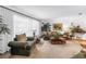 Bright and airy living room featuring comfortable seating and plenty of natural light at 11250 Tradewinds Blvd, Largo, FL 33773