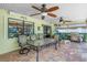 Covered patio area ideal for outdoor dining with ceiling fans, outdoor speakers, and grilling space at 11250 Tradewinds Blvd, Largo, FL 33773