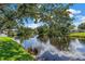 Lovely waterfront view of the pond and the sky from the backyard of this property at 11250 Tradewinds Blvd, Largo, FL 33773