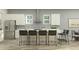 Bright, modern kitchen with stainless steel appliances and a central island with seating at 11518 Flourish Dr, Land O Lakes, FL 34637