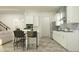 Open kitchen featuring an island with barstool seating and stainless steel appliances at 11518 Flourish Dr, Land O Lakes, FL 34637