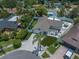 Aerial view of home featuring a white privacy fence, inground pool, outdoor kitchen, and artificial turf at 11763 Saree Ct, Largo, FL 33778