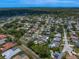 Panoramic aerial view of a residential neighborhood with lush greenery and scattered homes at 11763 Saree Ct, Largo, FL 33778