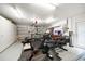 Finished basement features workout equipment, weights and mirrored wall and rubber mat flooring at 11763 Saree Ct, Largo, FL 33778