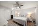 Primary bedroom with wooden floors, neutral walls, and a ceiling fan at 11763 Saree Ct, Largo, FL 33778
