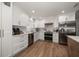 Kitchen featuring stainless steel appliances, white cabinets and subway tile backsplash at 11763 Saree Ct, Largo, FL 33778