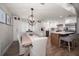 Bright eat-in kitchen features white cabinets, stainless appliances, wooden floors, and a large island at 11763 Saree Ct, Largo, FL 33778