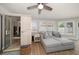 Living room with a sauna and plush sectional sofa near sunlit windows at 11763 Saree Ct, Largo, FL 33778
