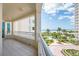 This condo's balcony features stunning ocean and beach views, plus views of the pool and lush landscaping below at 1180 Gulf Blvd # 504, Clearwater Beach, FL 33767