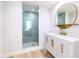 Stylish bathroom featuring a glass-enclosed shower with gold fixtures and a modern vanity at 1180 Gulf Blvd # 504, Clearwater Beach, FL 33767