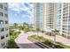 Luxury condo building featuring beautiful landscaping, fountain, and direct access to the beach at 1180 Gulf Blvd # 504, Clearwater Beach, FL 33767