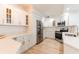 Modern kitchen featuring white cabinets, stainless steel appliances, granite countertops, and ample storage space at 1180 Gulf Blvd # 504, Clearwater Beach, FL 33767
