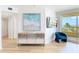 Bright living area featuring stylish furnishings, a modern TV, and scenic views from the balcony at 1180 Gulf Blvd # 504, Clearwater Beach, FL 33767