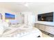 View of a luxury main bedroom featuring a dresser, TV, and decoratively appointed bed at 1180 Gulf Blvd # 504, Clearwater Beach, FL 33767