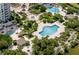 Beautiful aerial view of community pools and lush gardens amidst condo buildings at 1180 Gulf Blvd # 504, Clearwater Beach, FL 33767