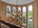 Stunning chandelier with large arched windows offering scenic views at 12125 Stonelake Ranch Blvd, Thonotosassa, FL 33592