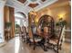 Formal dining room featuring a decorative chandelier, dining set, and garden access at 12125 Stonelake Ranch Blvd, Thonotosassa, FL 33592