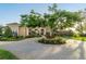 Circular driveway with mature landscaping leading to the home's entrance at 12125 Stonelake Ranch Blvd, Thonotosassa, FL 33592