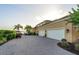 Large driveway with ample parking space leading to a multi-car garage at 12125 Stonelake Ranch Blvd, Thonotosassa, FL 33592