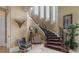 Grand foyer with high ceilings, detailed staircase, and natural light at 12125 Stonelake Ranch Blvd, Thonotosassa, FL 33592