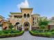 Elegant home exterior boasting manicured landscaping, a grand entrance, and architectural details at 12125 Stonelake Ranch Blvd, Thonotosassa, FL 33592